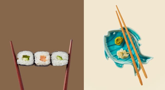 Chopsticks holding three seaweed wraps with rice and avocado next to blue fish shaped plate with sauce