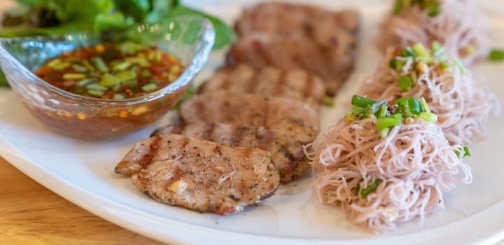 thai grilled pork tenderloin with noodle and organic vegetable. for website banner crop.