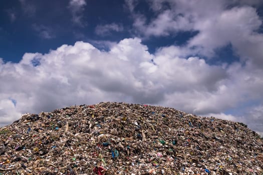Landfill With Cumulus Clouds, landscape with garbage dump