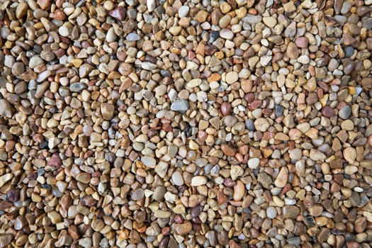 Brown white and blue pebble texture with various sizes.