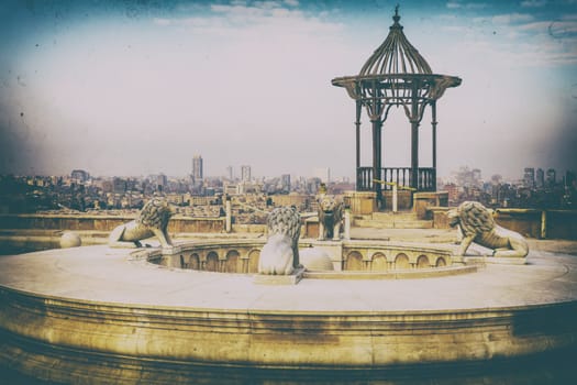 A fountain with lions and a rotunda in Cairo Citadel, retro style picture.