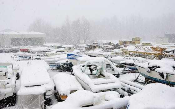 pleasure boats under snow in a parc