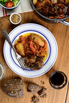 beef dish with carrots on the old table