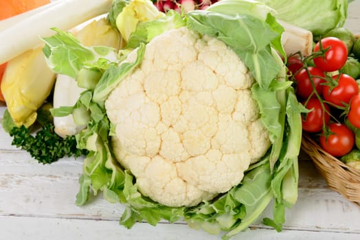 cauliflower and various vegetables on the vintage table