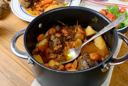 Beef casserole with carrots on the old table