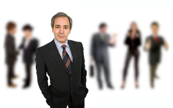 mature business man portrait with some people in the back