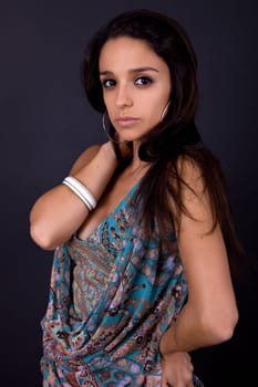 young beautiful brunette portrait against black background