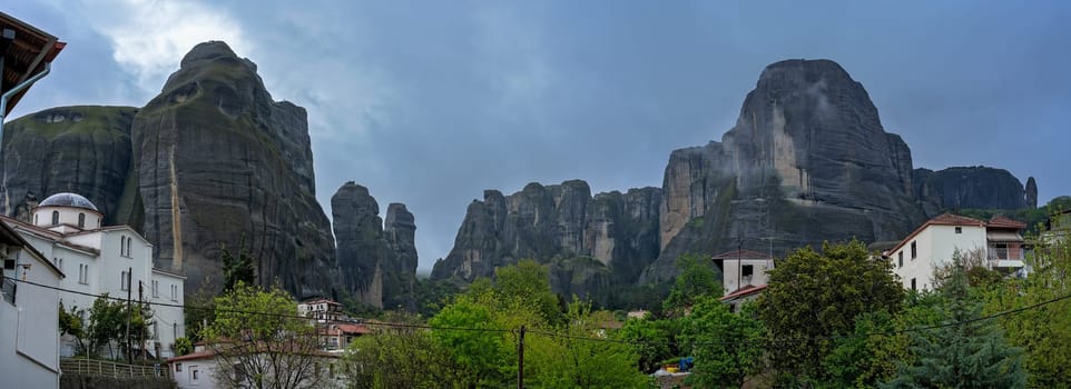 Panoramic view of the impressive rock formations and landscape as seen in the small Kastraki settlement in Meteora at dusk, Trikala region, Greece