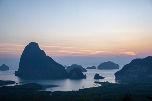Morning sunrise. Mountains in the Andaman Sea..March 2019: Samed Nang Phi Phang Nga, Thailand