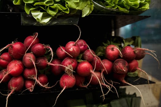 A close-up shot of an abundance of fresh Beetroot on display at a market stall.