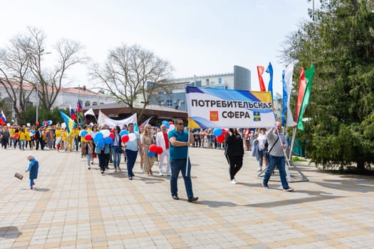 Anapa, Russia - May 1, 2019: May Day demonstration with a banner "Consumer sector"" in the resort city of Anapa"