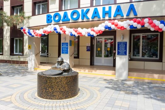 Anapa, Russia - May 1, 2019: Monument to the plumbing "Bronzi Petrovich"" at the central entrance of the water utility building in Anapa, Russia"