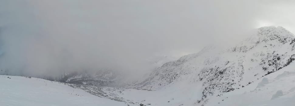 Beautiful foogy Winter morning in Mountains. Landscape with Todorka Peak panorama, Pirin mountain, Bansko, Bulgaria.