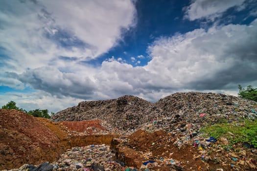 Garbage Dump Hill, landscape with landfill and clouds