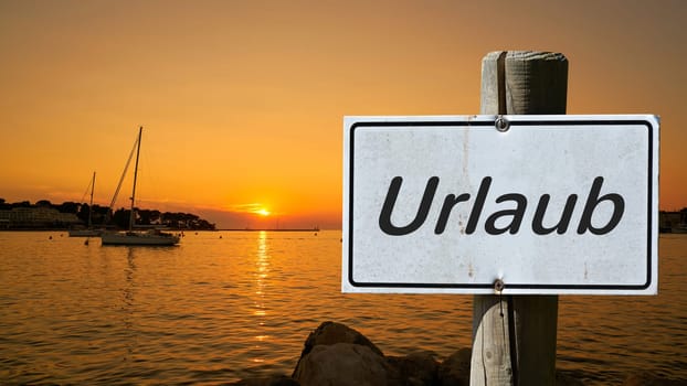 Sign with the inscription "Holiday"" on the shore of the Adriatic in Croatia"