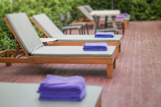 Bench at swimming pool in the hotel, stock photo