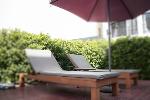 Bench at swimming pool in the hotel, stock photo