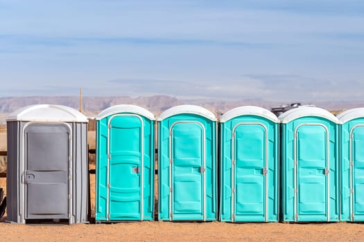 Row of public Portable mobile toilet on the street outdoor