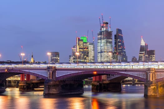 London Skylines building with river thames sunset twilight in London UK.