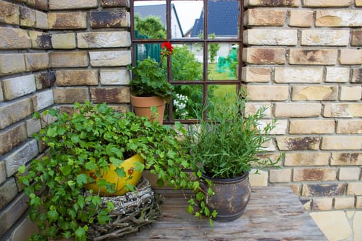 beautiful place in the garden in the mediterranean style, pots with plants on the table