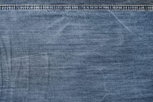 Old jeans background. Denim texture for design.