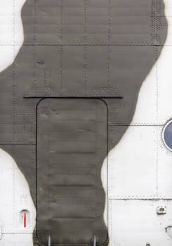 Old military background. Fragment of a disused helicopter close-up.