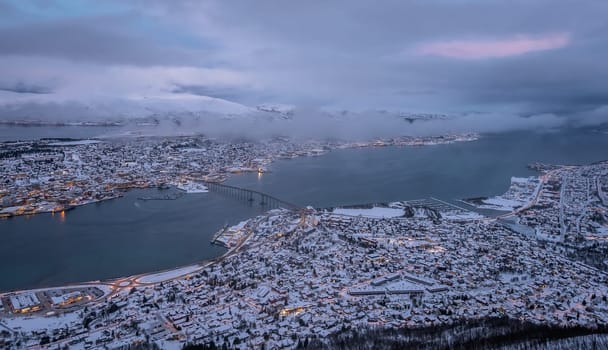 Aerial view to the city of Tromso in winter from above, Northern Norway