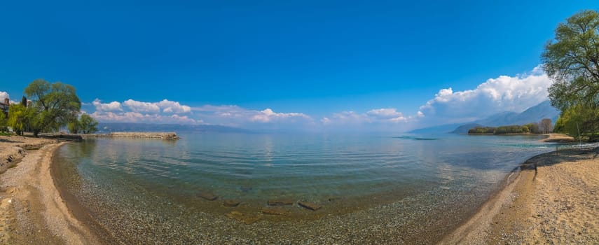 Panoramic view of the beach on the shore of Lake Ohrid in Sveti Naum, Republic of Macedonia