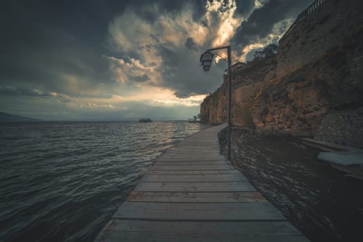 Wooden gangplank over Lake Ohrid at dusk, Republic of Macedonia