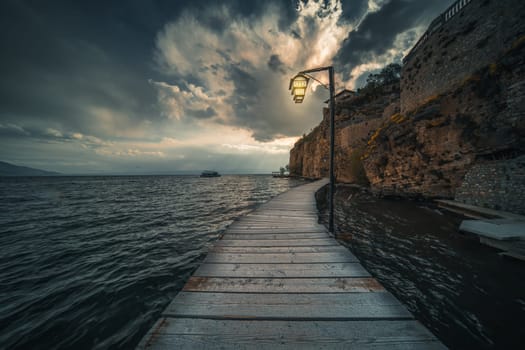 Wooden gangplank over Lake Ohrid at dusk, Republic of Macedonia