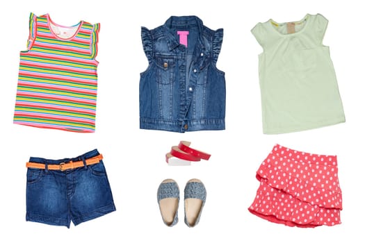 Collage set of little girl summer clothes isolated on a white background. The collection of a sleeveless jeans vest and jeans shorts, shoes, short summer skirt, two shirts and a belt. Little girl fashion.