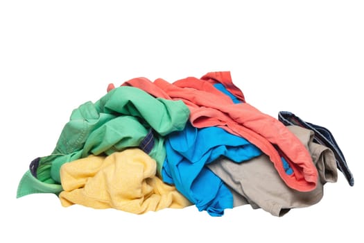 Pile of clothes isolated. Stack of colorful dirty clothes ready for the laundry isolated on a white background.