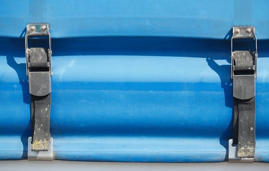 Blue truck tarpaulin with ratchets / clamps for fixing truck tarpaulins..
