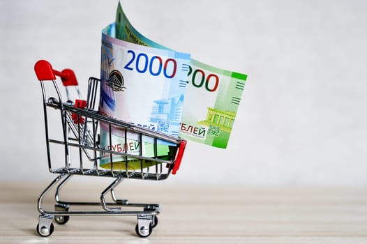 Russian money banknotes in a shopping trolley, online shopping concept