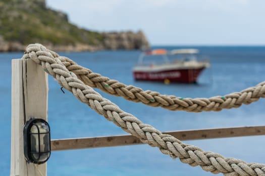 Ropes around wooden restaurant platform in Agios Nikolaos beach on Zakynthos Island, Greece