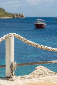 Ropes around wooden restaurant platform in Agios Nikolaos beach on Zakynthos Island, Greece