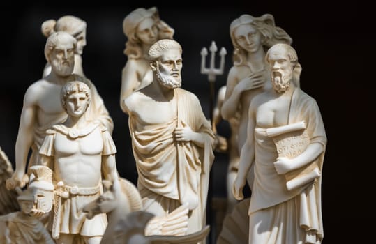 Small statuettes resembling people from ancient Rome and Greece on sale on a souvenir stand, Greece