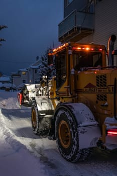 Tromso, Norway -  December 2018 : Powerful snowplough clearing residential roads in Tromso town in winter