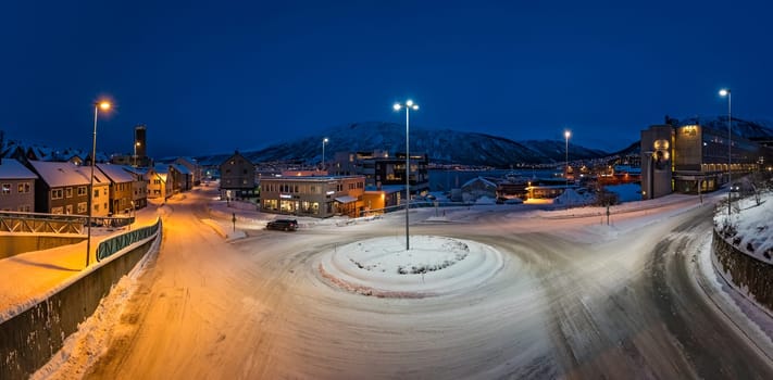 Tromso, Norway -  December 2018 : Panoramic view of the snow covered roundabout in the city of Tromso in winter