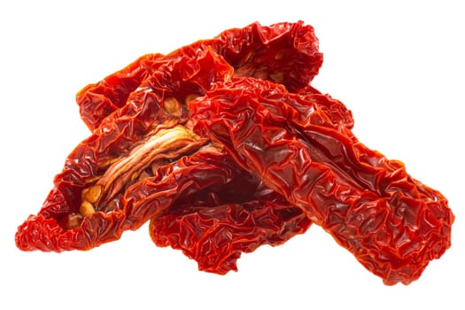 Sundried or dried datterini tomato halves, isolated, pile of