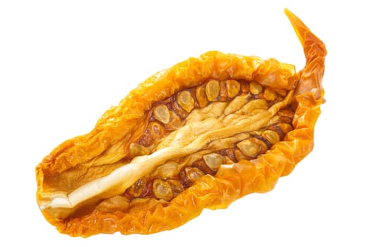 Sundried or dried yellow oblong tomato half, isolated