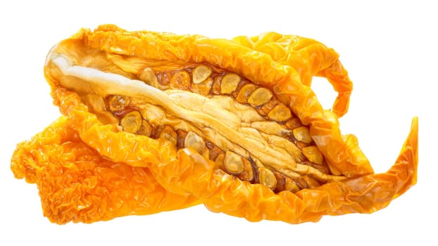 Sundried or dried yellow oblong tomato halves, isolated