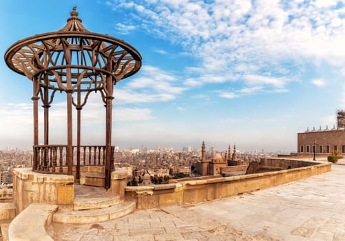 Old pavilion on the Citadel roof and the Mosque-Madrassa of Sultan Hassan on the background, Cairo, Egypt.