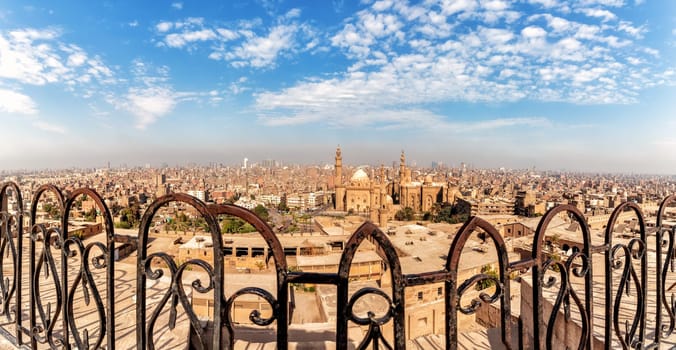 View on the Mosque-Madrassa of Sultan Hassan through the forged fence of the Citadel of Cairo.