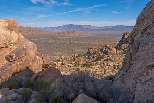 Desert Vista Through a Rocky Window on Teutonia Peak in the Mojave National Preserve in California