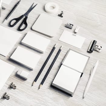 Blank stationery mock up on light wooden background.
