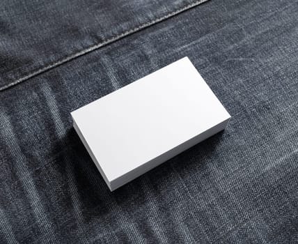 Mockup of business cards stack at denim background.