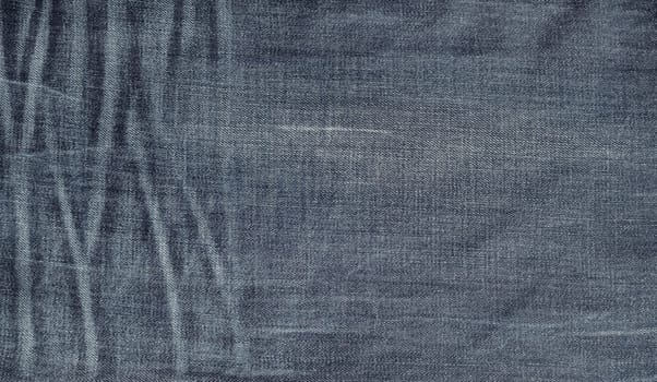 Old jeans texture. Vintage denim as background.
