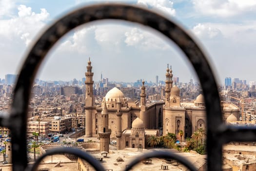 View on the Mosque-madrasa of Sultan Hassan through the old gate of the Citadel in Cairo.