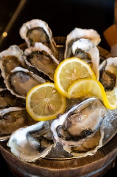 Fresh Oyster serve in wooden bucket